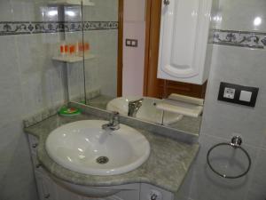 Een badkamer bij Pension Via-Stella