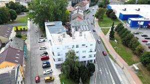 an aerial view of a city with a white building at Apartmány Škodova Přerov in Přerov +3 photos