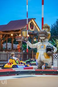 a statue in front of a ride at a amusement park at Luxury Caravan at Union Lido in Cavallino-Treporti +70 photos