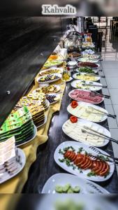 a buffet line of plates of food on a table at Boğaz Otel in Çanakkale