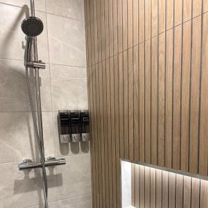 a shower with a glass door in a bathroom at Spacious 2 bedroom apartment in Killarney in Killarney