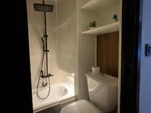 a bathroom with a shower and a toilet and a sink at FK studio in Abidjan +17 photos