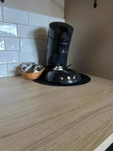 a coffee maker sitting on top of a counter at Les Iris - Maison chaleureuse in Montigné-sur-Moine