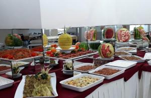 a buffet with many different types of food on a table at Hotel Eylül in Erdemli