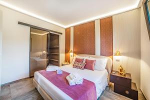 a hotel room with a bed with towels on it at Alternative Resort & SPA in Scorrano +58 photos