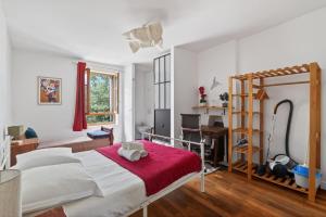 a bedroom with a bed and a desk and a ladder at Premium 1BR flat with direct access to the RER B in Gentilly