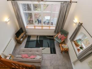 an overhead view of a living room with a couch and a window at Horse Gin in Lydney
