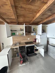 a kitchen with white cabinets and a sink at MILANO Central Station House in Milan