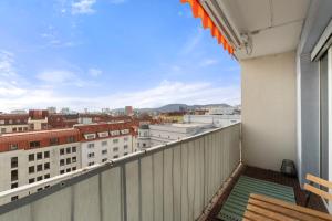 a balcony with a view of a city at Zentral und Ruhig am Park - 2BR - gratis Parken - 2 Balkone in Graz