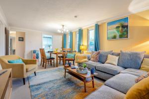 a living room with a couch and a table at 2 Bed in Sandhurst oc-o34807 in Sandhurst