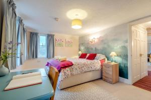 a bedroom with a bed and a table in it at 2 Bed in Sandhurst oc-o34807 in Sandhurst