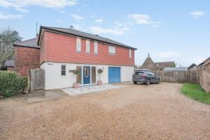 a house with a car parked in a driveway at 2 Bed in Sandhurst oc-o34807 in Sandhurst