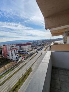 a view of a city from the balcony of a building at Apartament Dem Rădulescu, Rm Vâlcea in Troian