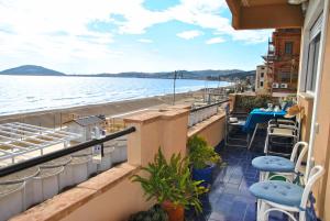 a balcony with chairs and a view of the water at Casa Edy mare e spiaggia a Formia in Latina +22 photos