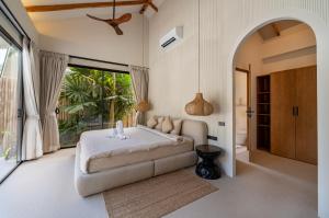 a bedroom with a bed and a large window at K Villas Phangan 04 in Ban Madua Wan +68 photos