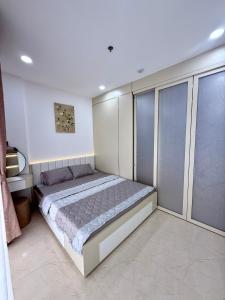 a bedroom with a large bed in a room at Phú Tài Central Life in Quy Nhon +13 photos