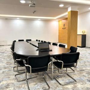 a conference room with a table with a laptop on it at Hotel Residence Travnik in Travnik +75 photos