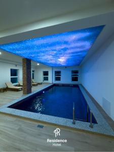 a swimming pool with a starry sky mural on the ceiling at Hotel Residence Travnik in Travnik