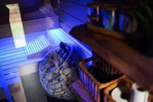 a basket of eggs in a cage on a shelf at Magical Wellness Cottage Trvalka in Křimov +23 photos