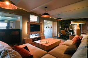 a living room with a couch and a coffee table at Oklm6 in Mellet