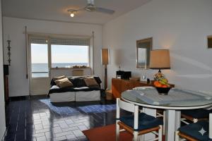 a living room with a couch and a table at Casa Edy mare e spiaggia a Formia in Latina