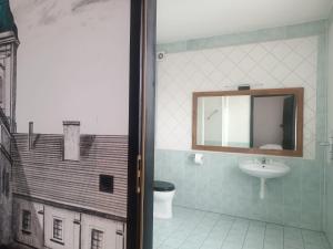 a bathroom with a sink and a mirror at Polka in Chojnice