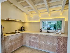 a large kitchen with a counter and a window at Bella Mar in Son Carrio