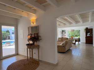 a living room with a couch and a table at Bella Mar in Son Carrio