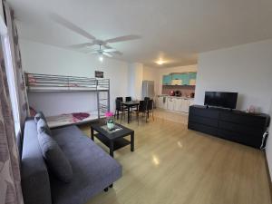 a living room with a couch and a table at Perla View Apartment in Primorsko