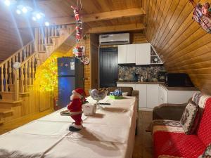 a santa figurine standing on a table in a kitchen at Horizon Racha in Ambrolauri +43 photos