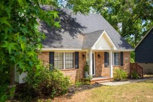 a brick house with a gray roof at King 3bedroom, centrally located in Augusta