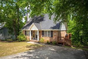 a brick house with a porch and a deck at King 3bedroom, centrally located in Augusta +58 photos