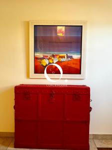 a red dresser with a painting on top of it at GC - Basse Mer in Wissant +53 photos