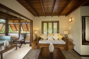 a living room with a couch and a chair at Villa C'est La Vie in Rodney Bay Village +44 photos