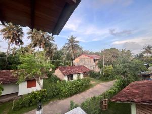 an overhead view of a village with houses and trees at Sunil VIlla in Talpe