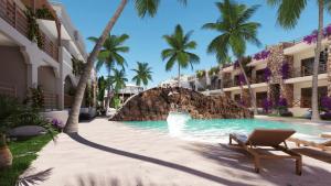 a pool at a resort with a rock waterfall at Luxury Resort e Hotel Ltda in Jericoacoara