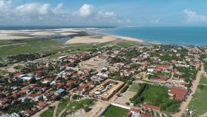 an aerial view of a town next to the ocean at Luxury Resort e Hotel Ltda in Jericoacoara