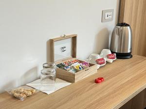 a table with a mirror and a container of food at B&B Affittacamere Vecchia Alimini in Otranto
