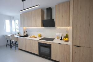 a kitchen with a sink and a stove top oven at Noctua Duquesa Beach 009 in Manilva