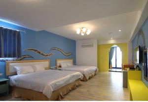 Postel nebo postele na pokoji v ubytování Sky Blue Ocean B&B