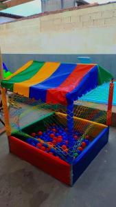 a colorful play table with balls in it at Ilhabela quarto próx praia in Ilhabela