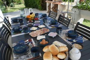 a long table with food and bread on it at B&B da Nic e Ste in Casalbordino +11 photos