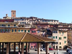 a group of buildings on a hill with at Casa dell' Onda 25 in Siena