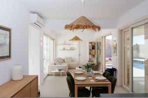 a living room with a table and a couch at Arcadia Naxos in Naxos Chora