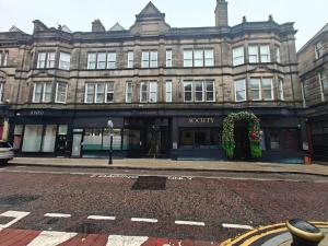 a building on the corner of a street at Executive 1-Bed Apartment in Town in Bury +6 photos