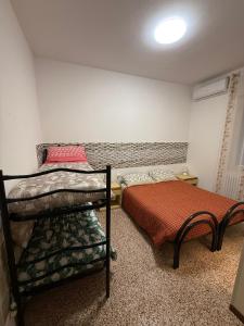 a bedroom with two bunk beds next to each other at B&B Tre di Cuori in Campiano