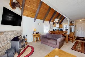a living room with a couch and a fireplace at Mammoth View Villas 30 in Mammoth Lakes