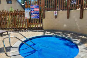 a blue frisbee in a pool in front of a fence at Mammoth View Villas 30 in Mammoth Lakes