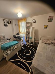 a dorm room with two beds and a room with a room at Chez Ismael in Melun