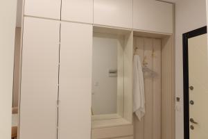 a bathroom with a shower and a white cabinet at Ilyonis Residence apartment luxury in Shëngjin +12 photos